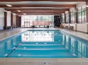 A long indoor pool and a large panel of windows