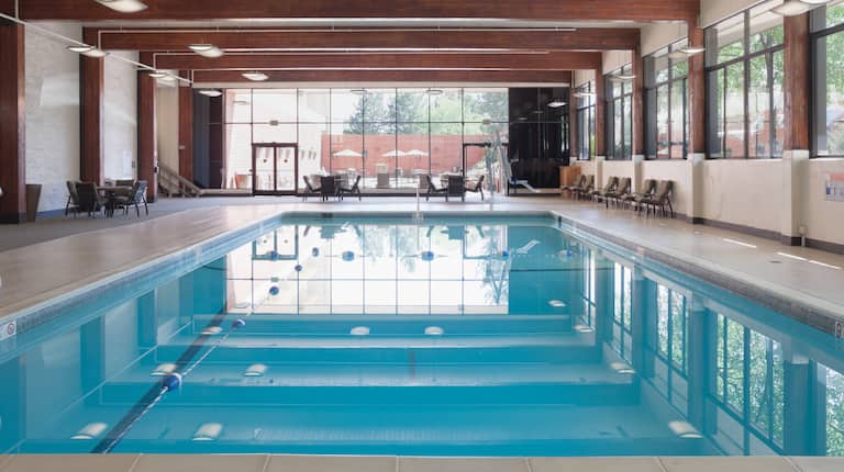 A long indoor pool and a large panel of windows