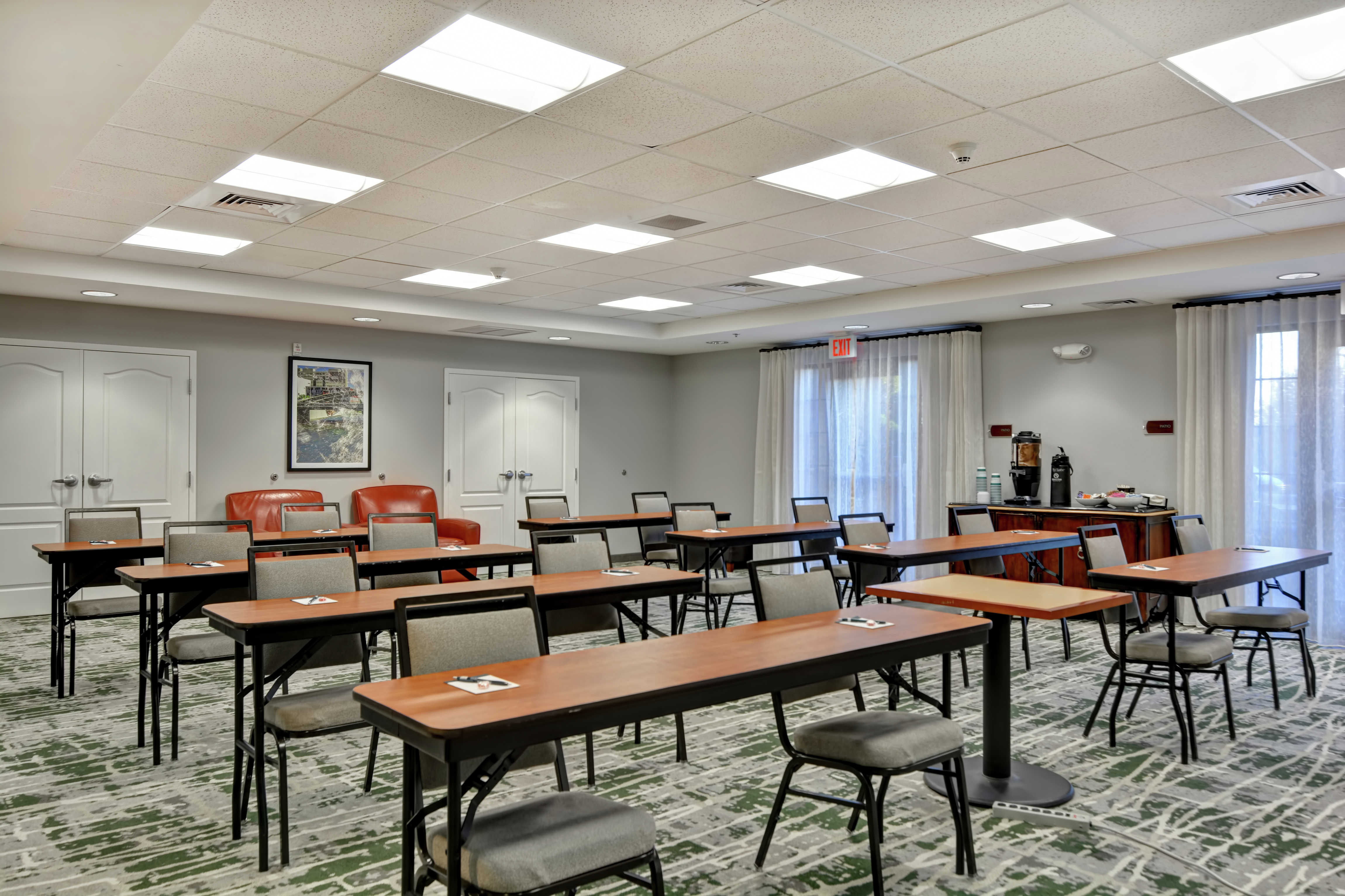 Meeting Room Space with Tables and Seating Arrangement