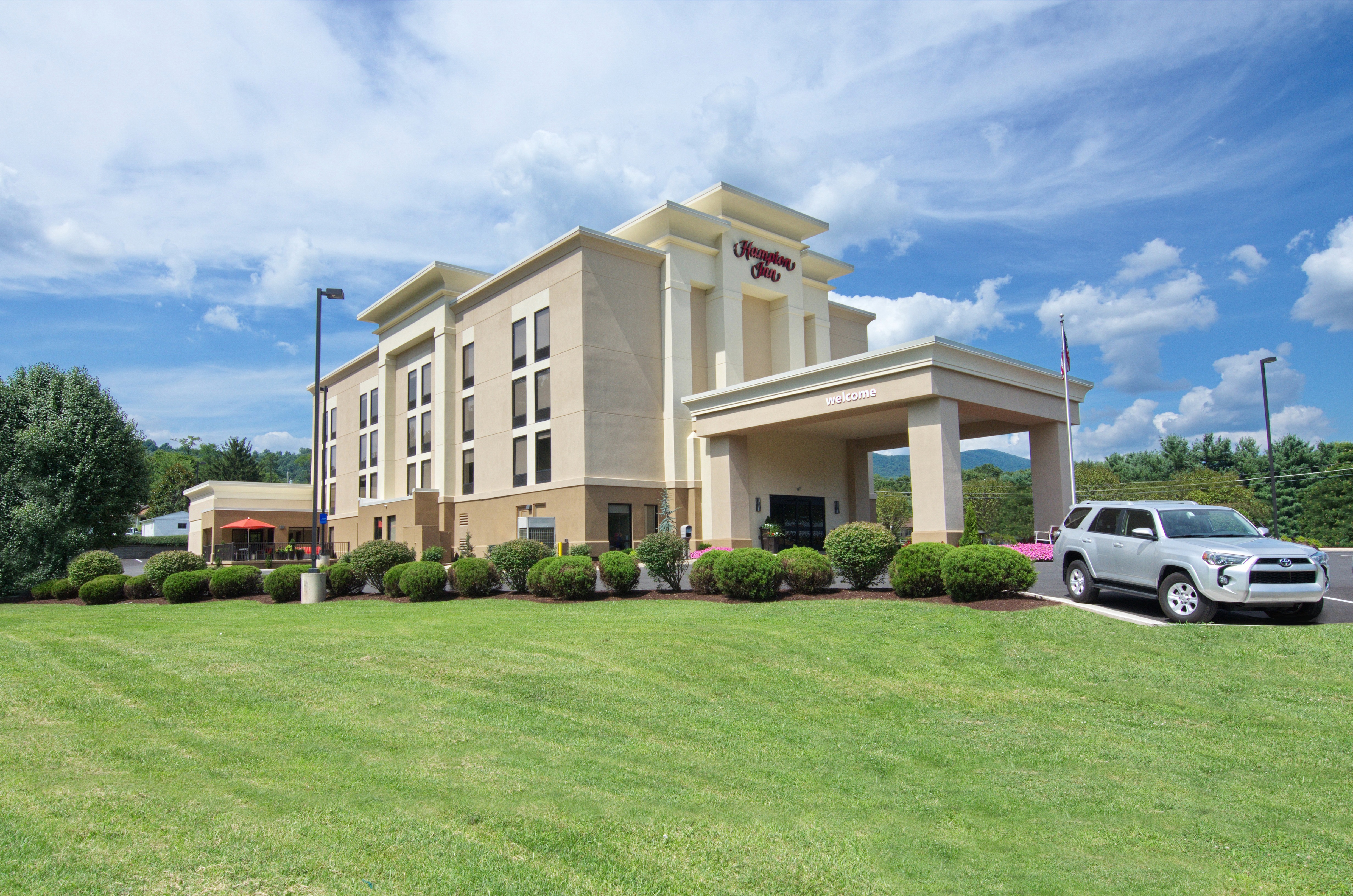 Hotel Building Exterior with Front Lawn