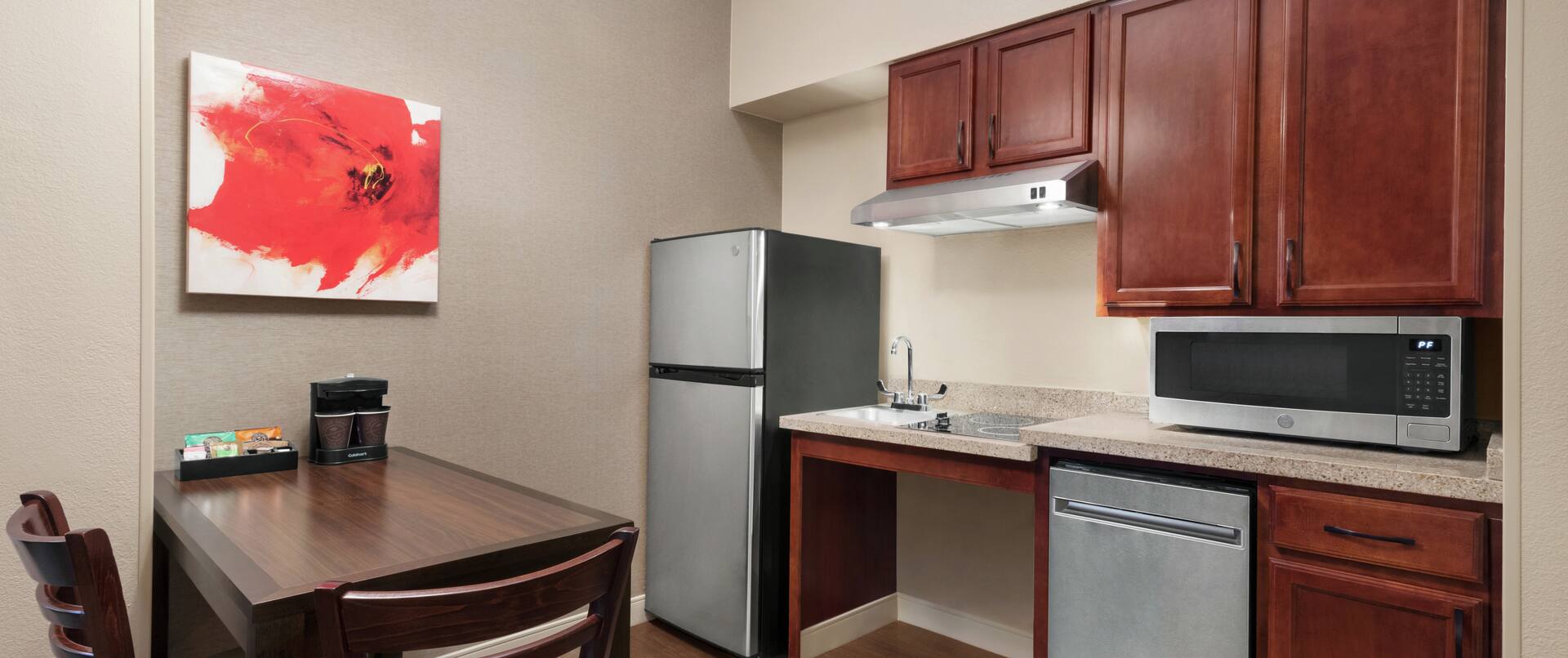 Guest Room Kitchen with Sink, Stove Top, Dishwasher, Microwave and Full Size Refrigerator 