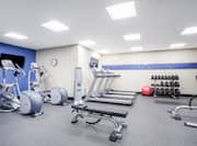 Fitness Center with Treadmills, Weight Bench, Cross-Trainers and Dumbbell Rack