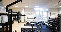 Fitness Center with Weight Benches, Weight Machines and Dumbbell Rack