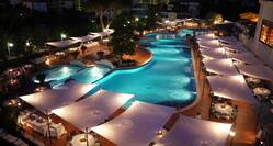 Outdoor Swimming Pool At Night With Banquet Setup