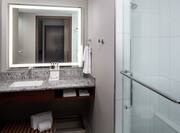 Guest Bathroom with Lit Mirror and Shower with Sliding Doors
