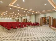 Olaya Hall Meeting Room Arranged Theater Style With Rows of Red Chairs 