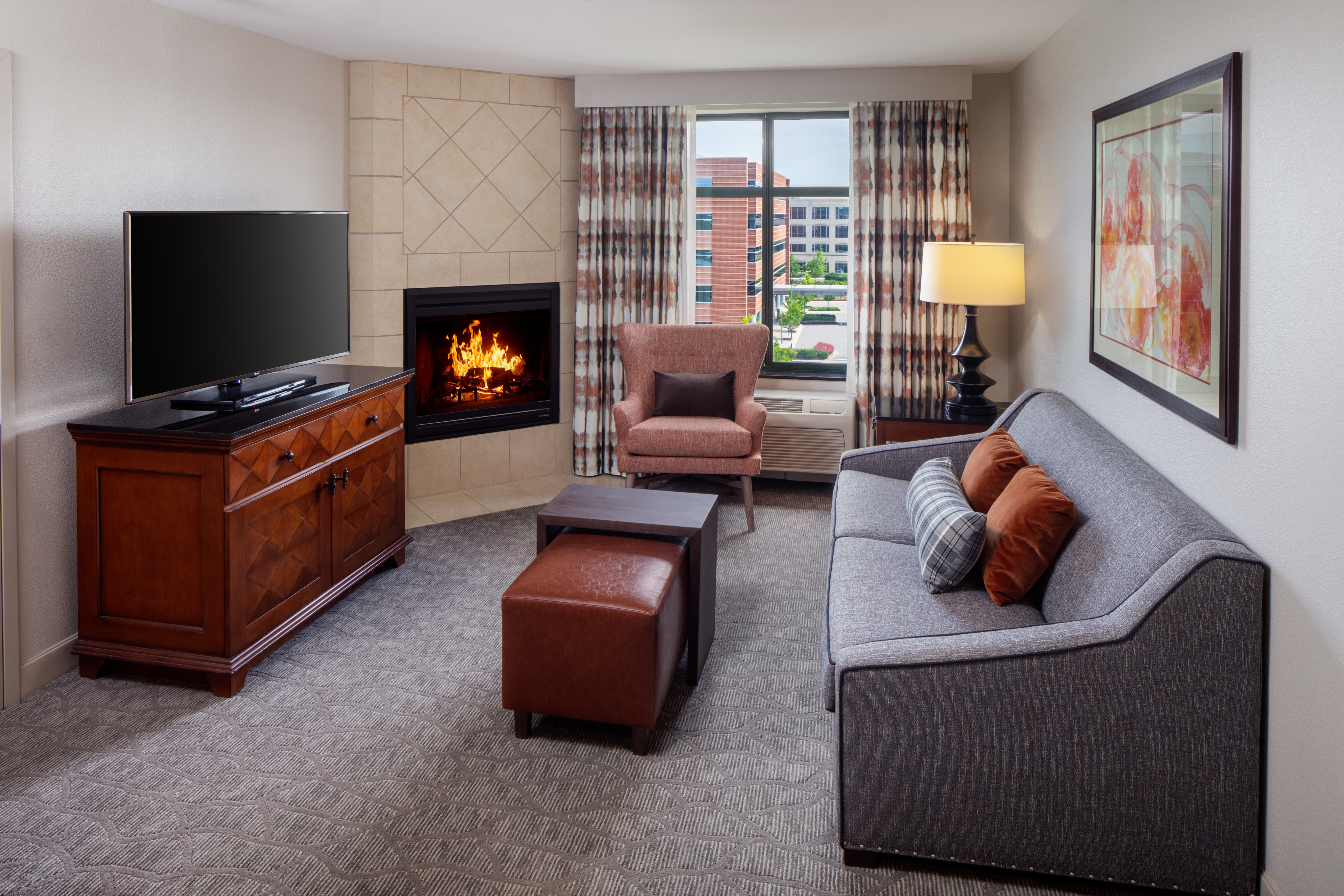 Suite Living Area with sofa, fireplace and tv