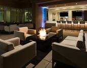 Bar with Outdoor Patio Seating Area and Fireplace