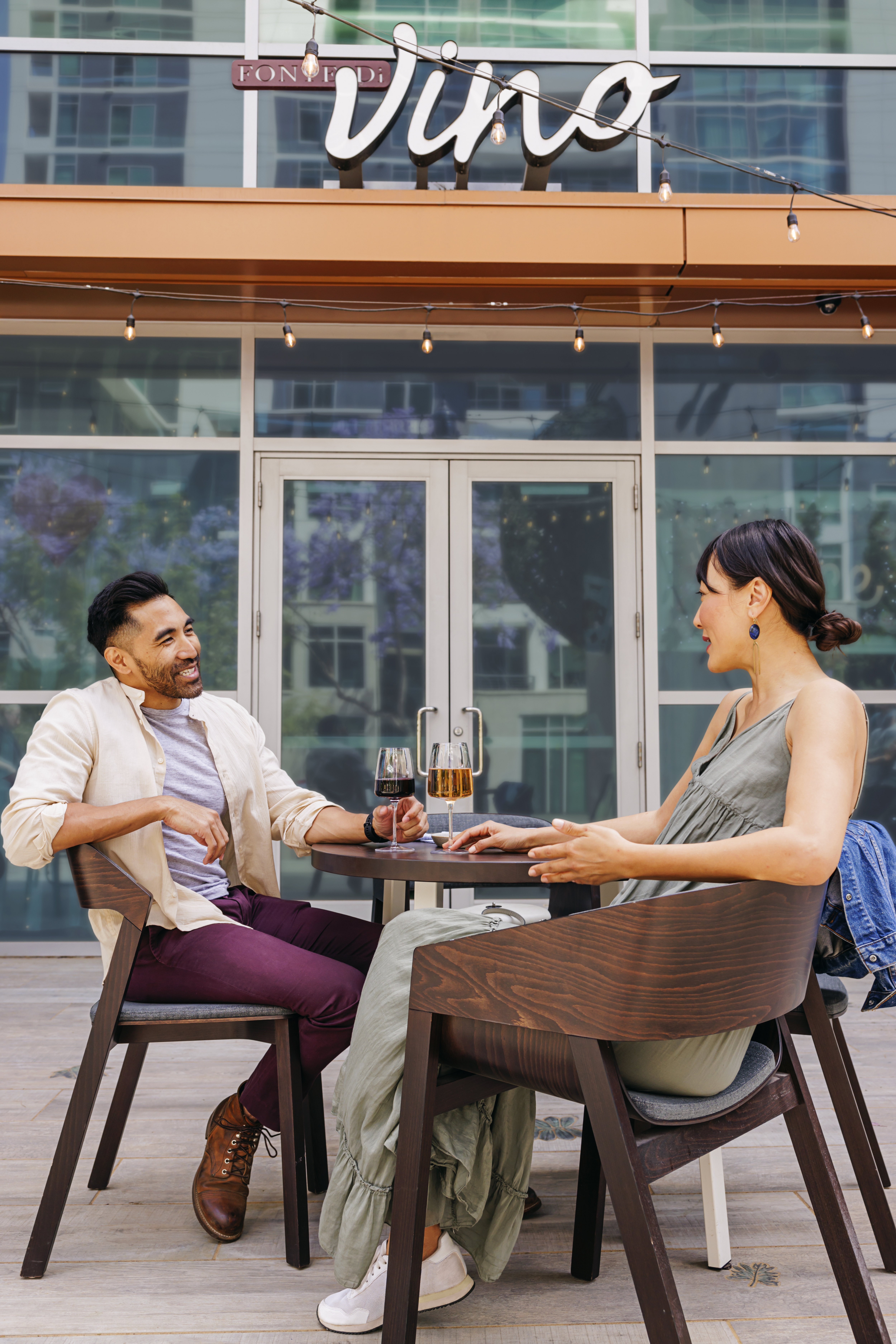 Man and woman sitting outside restaurant