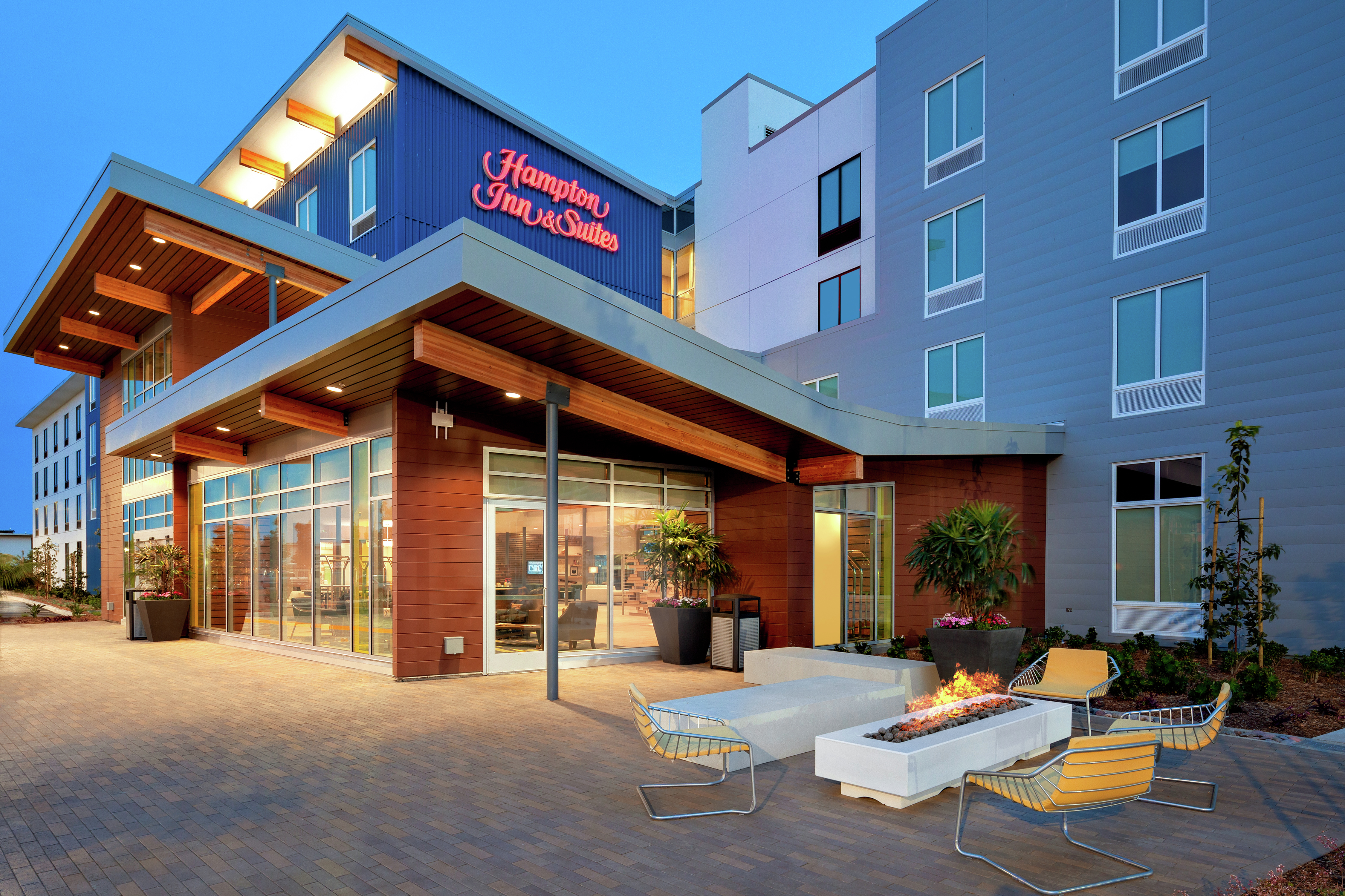 Hotel Exterior in the Evening and View of Firepit