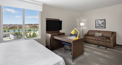 King Water View Suite with Desk TV and Sofa