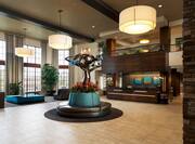 Lobby area with front desk and sculpture