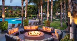 Circular Firepit by Outdoor Pool in Evening