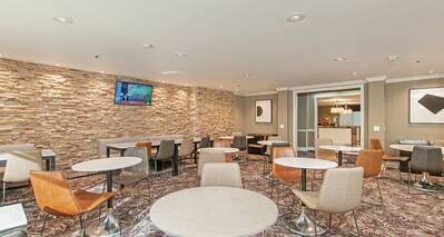 Hotel dining area with table seating. 