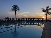 Outdoor pool at sunset
