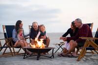 People at Beach with Fire Pit