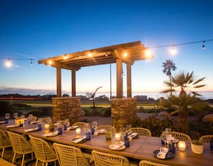 Chandler's Oceanfront Dining patio seating at dusk