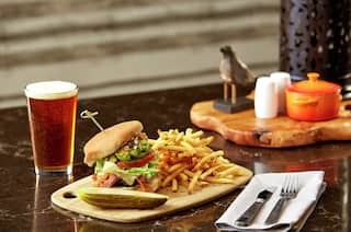 Gourmet Burger and Fries with Glass of Beer