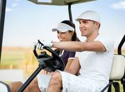 Couple Riding a Golf Cart