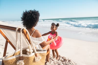 Mother and Daughter Having Fun at the Beach