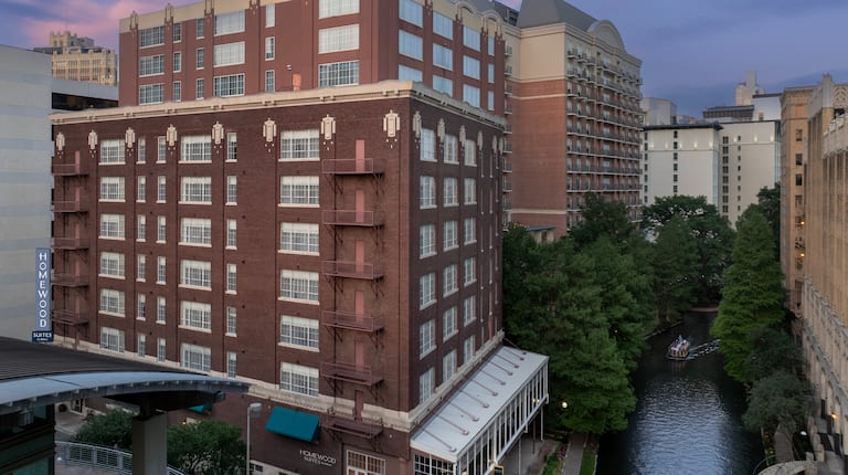 dusk exterior shot of hotel and riverwalk