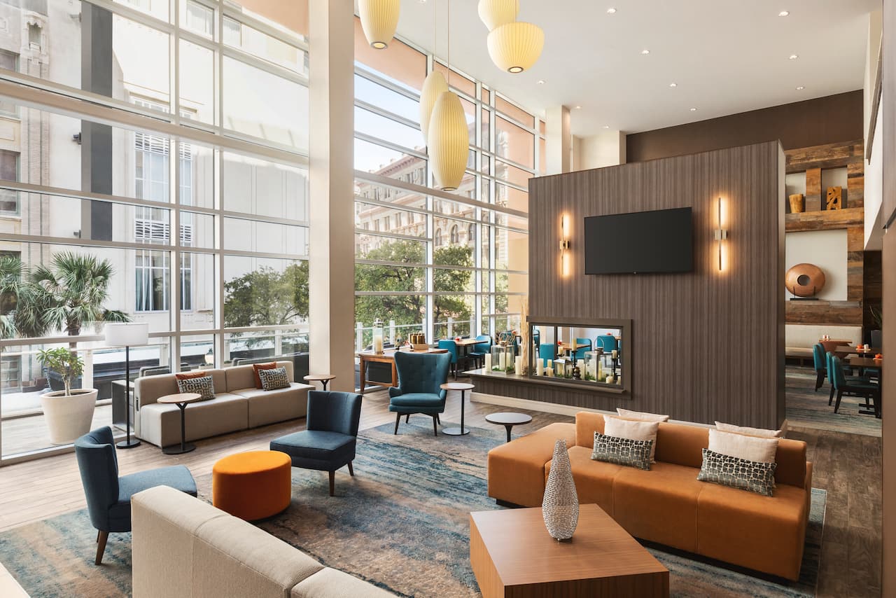Spacious hotel lobby with modern design and comfortable seating