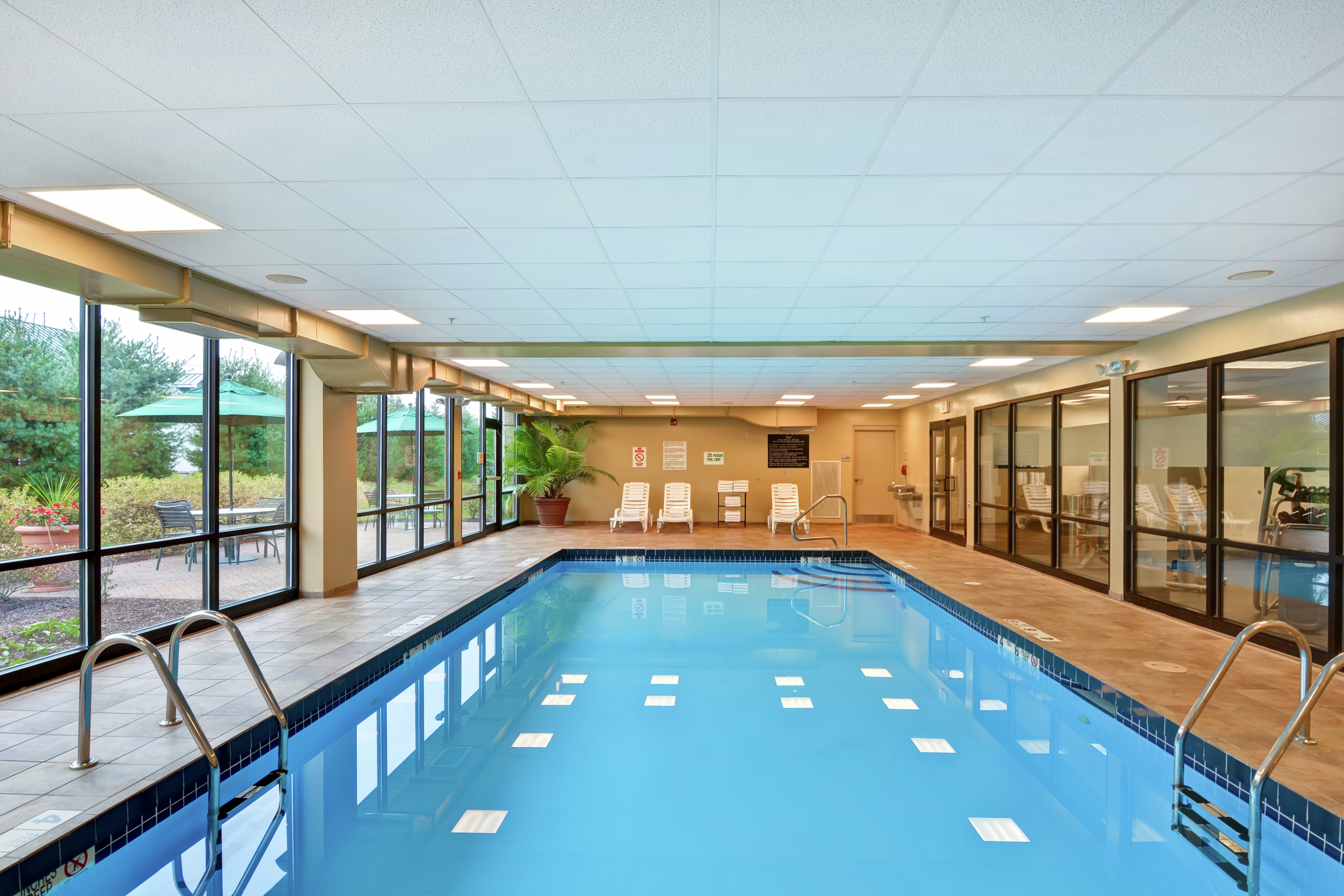 Indoor Swimming Pool Area with Large Windows