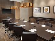 Salon A Meeting Room with Long Conference Table and Large Flatscreen on the Wall