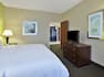 Accessible Single King Guestroom Suite Bedroom with View of Kitchen