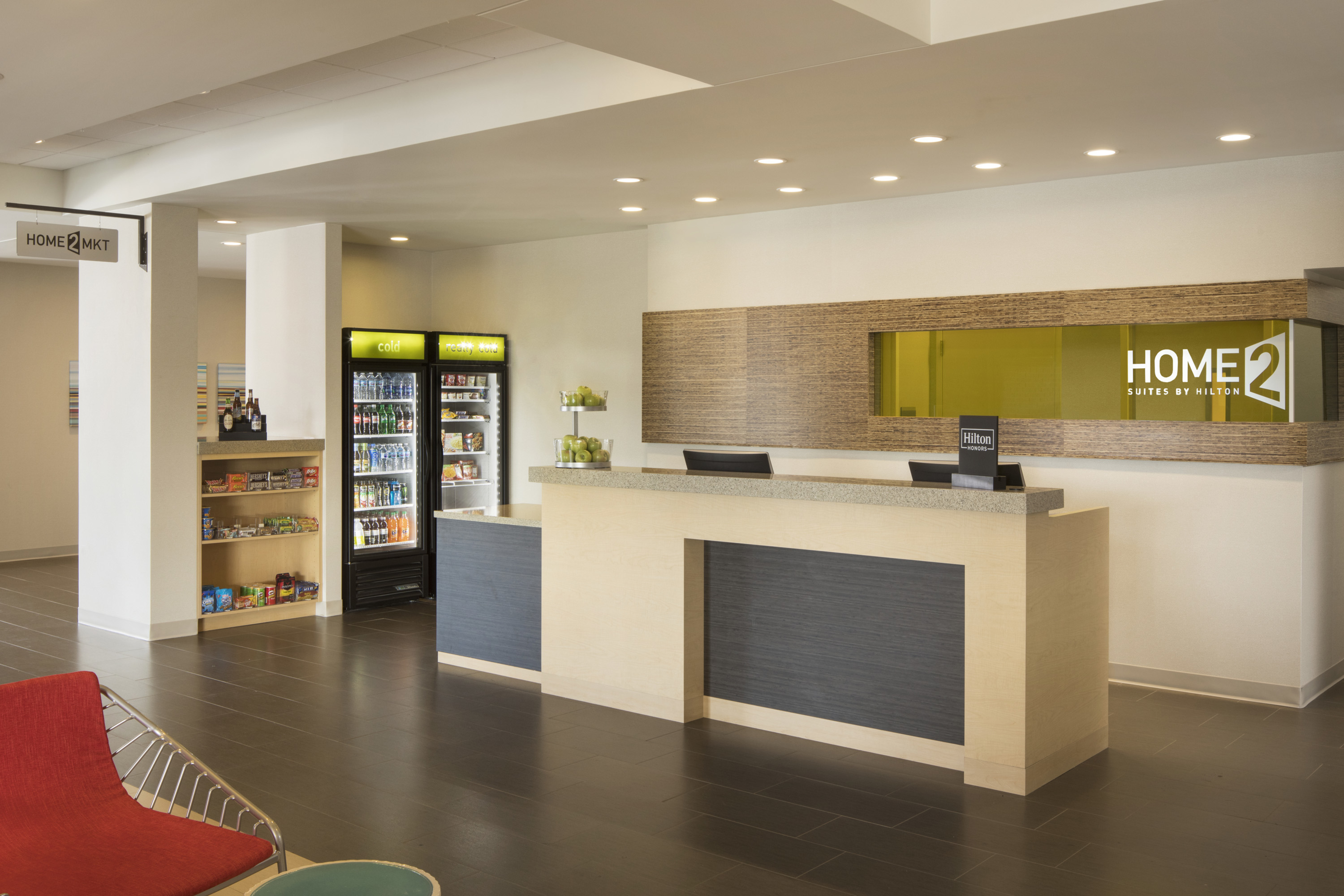 Lobby front desk with small snack shop suite