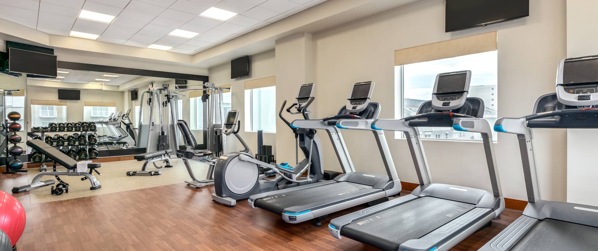Treadmills Recumbent Bikes and Weights in Fitness Center