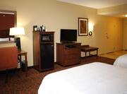 Two Queen Beds, Work Desk, Hospitality Center, TV, Wall Art, and Entry in Guest Room