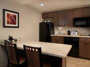 Guestroom Kitchen Area with Refridgerator, Microwave and Cooker
