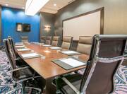 Boardroom with Leather Chairs and Video Wall Monitor