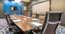Boardroom with Leather Chairs and Video Wall Monitor