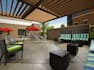 Outdoor Patio and Lounge Area with Overhanging Pergola 