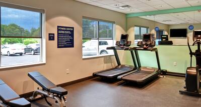 Fitness Center with Treadmills, Cross-Trainer and Weight Benches