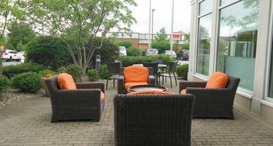 Outdoor seating area with tables and chairs