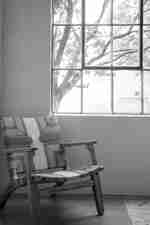 Chair next to window in guestroom