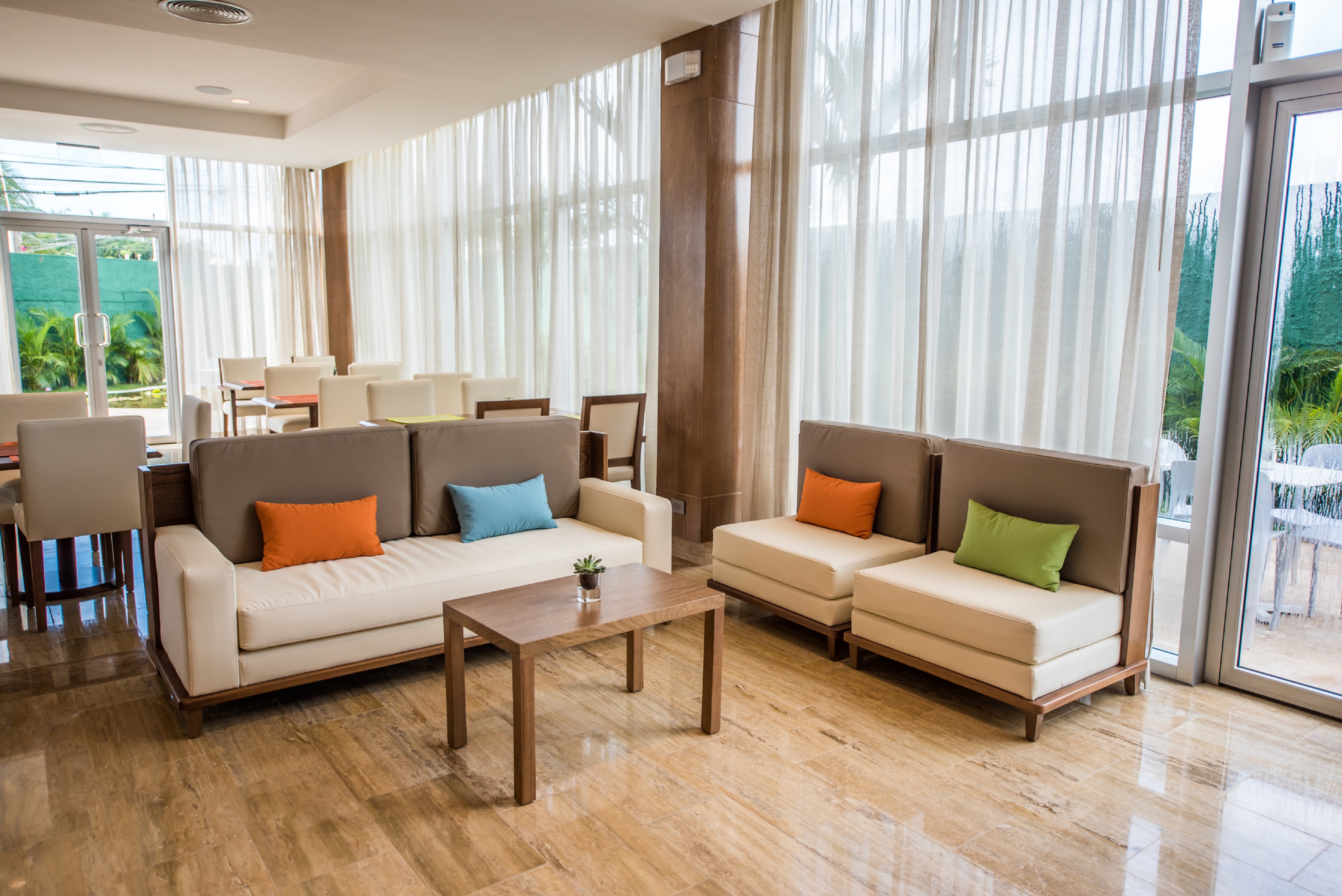 Lobby Seating Area with Sofa, Soft Chairs and Coffee Tables