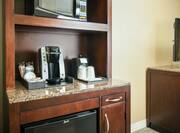 Detailed View of Hospitality Center With Mini-Fridge, Keurig, Sink, and Microwave