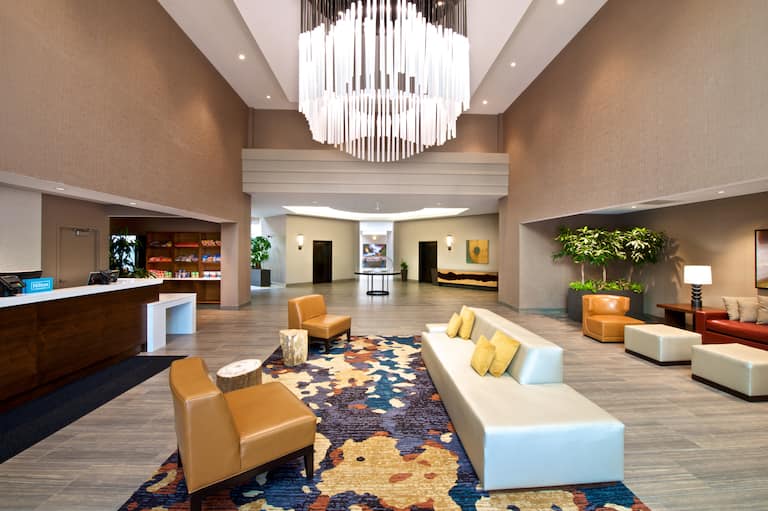 Lobby with Large Chandelier and Seating Area