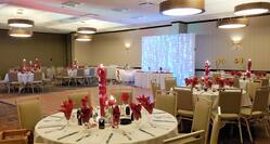 Red Roses Wedding Reception Ballroom with Tables and Chairs