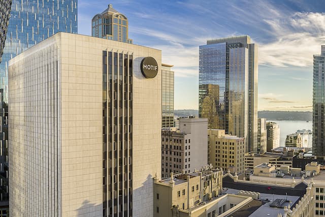 panoramic view of hotel exterior and cityscape