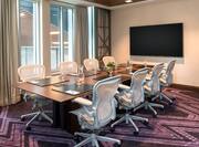 Boardroom with Conference Table, Wall Mounted Television and Outside View