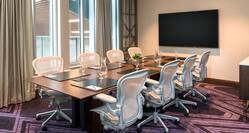 Boardroom with Conference Table, Wall Mounted Television and Outside View