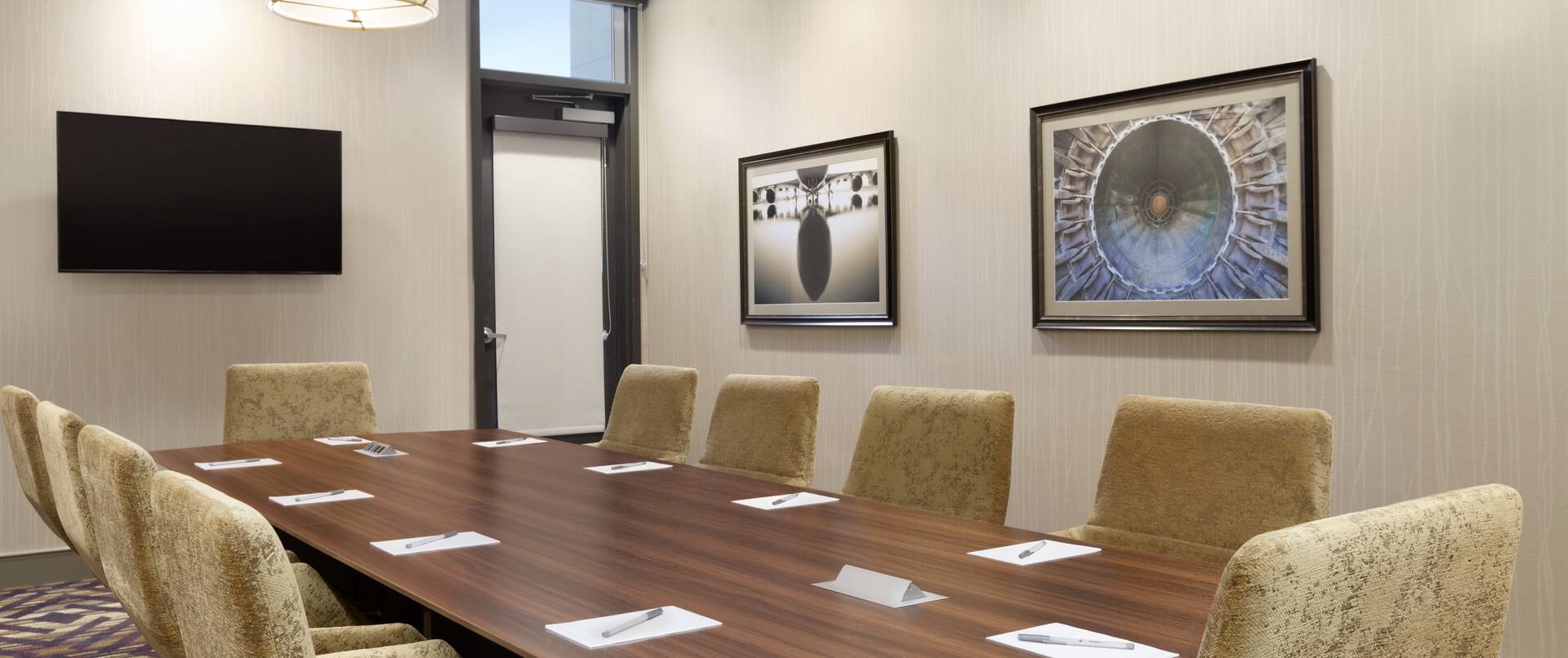 Boardroom with Table, Chairs and Wall Mounted HDTV