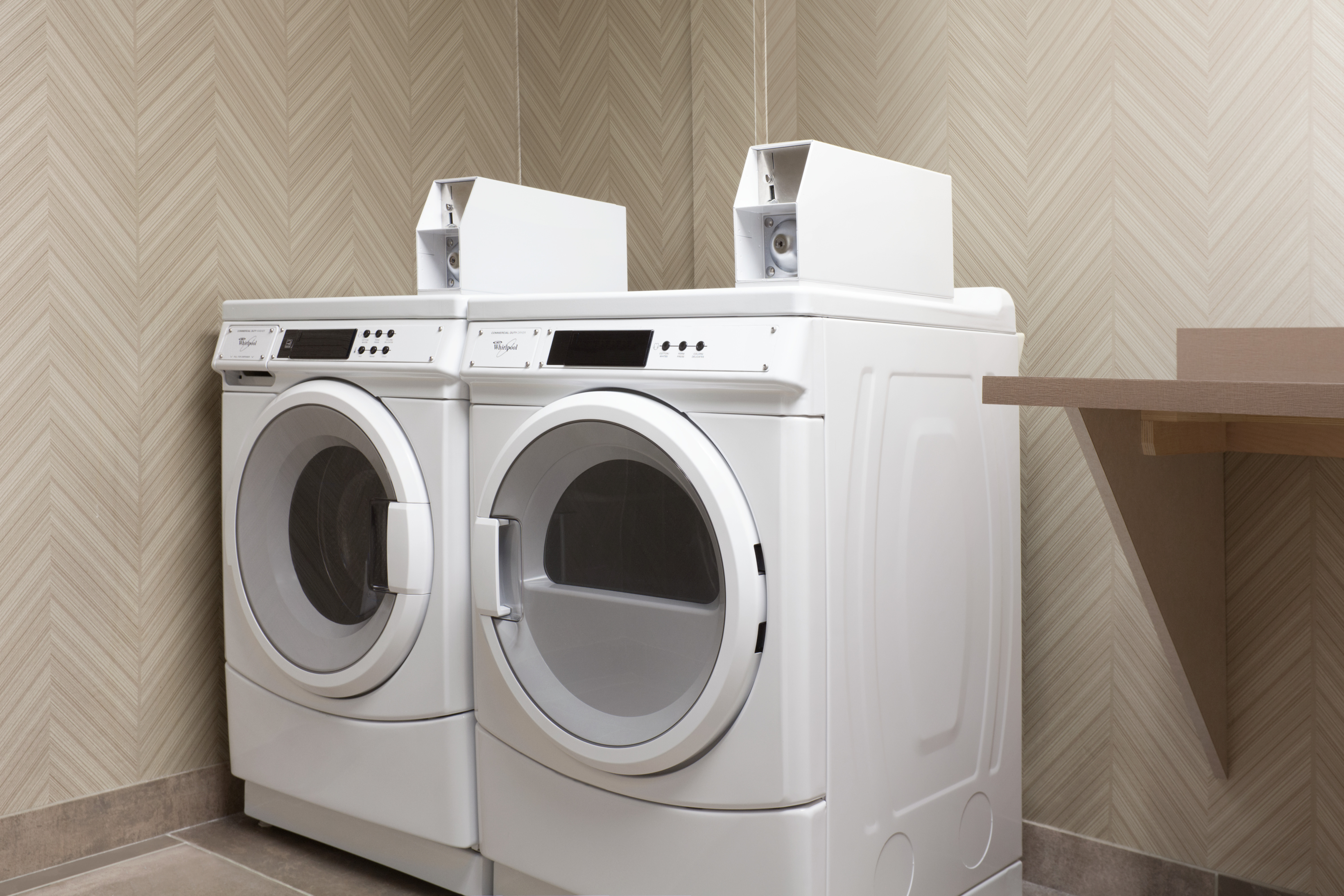 Guest Laundry Room with Coin Operated Washing Machines