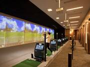 Man Playing Virtually Reality Golf Game