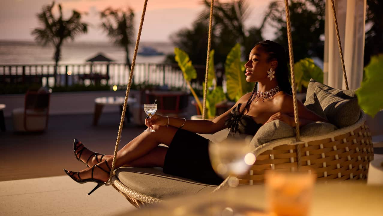 Woman Relaxing Outdoors, Enjoying the Sunset at Lalin